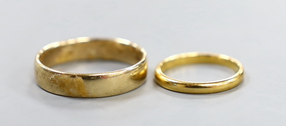 A 9ct gold wedding band, 3.8 grams and a small 22ct gold wedding band, 2.4 grams.